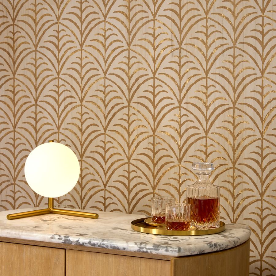 The classic palm motif of Royale is carefully etched onto pieces of hand dyed wood veneer that reveals a foil backing in some areas to add a hint of shine. The thin sheets of veneer are collaged together and dyed, with a subtle wash of color that allows the natural woodgrain to show its character. The regal motif and smooth finish add allure to any interior.