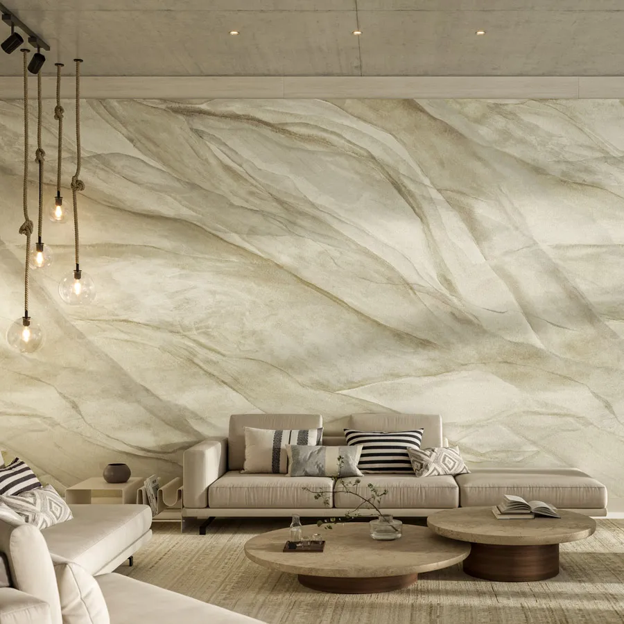 Marina draws inspiration from the elegance of ancient Roman drapery, where billowing lengths of fabric were used to flaunt prestige and are immortalized in stone and other works of art. Traditional Roman drapes are reimagined as a beautiful, hand-painted mural printed onto grasscloth. Layered folds and creases sweep across this five-panel mural, creating a soft, sculptural surface available in four soft and elegant colorways.