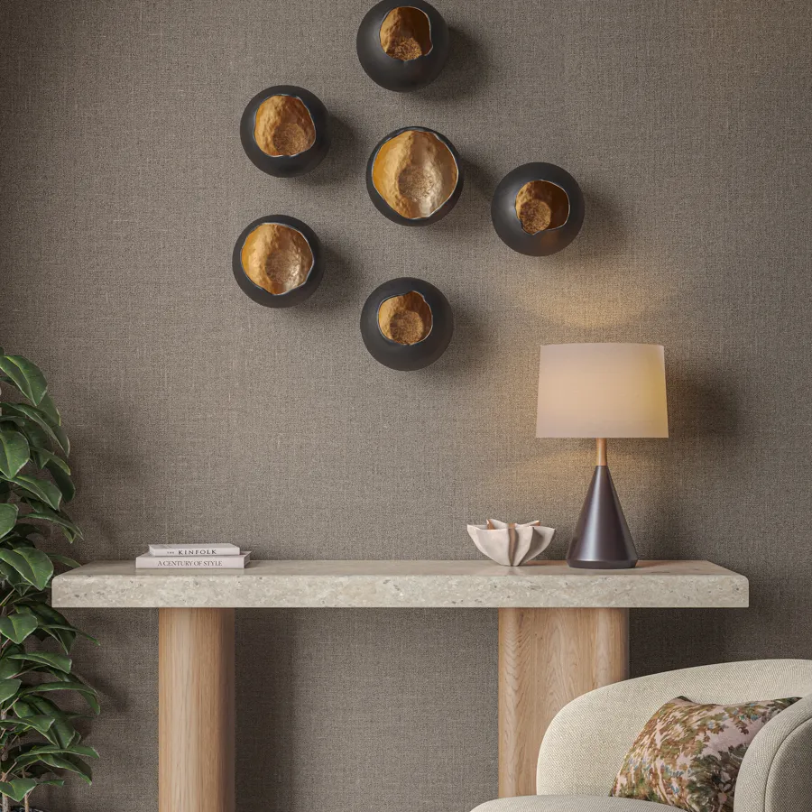 Empire draws on the enduring legacy of raw jute, honoring its heritage and timeless texture. The simplistic yet durable nature of this material is celebrated as the primary design element in Empire, expressed through an intricate yet intentionally coarse weave that invites textural interest. The fiber’s inherent range of golden tones are complimented by Empire’s rich palette of warm, neutral hues, adding luxurious, tactile depth to the wall.