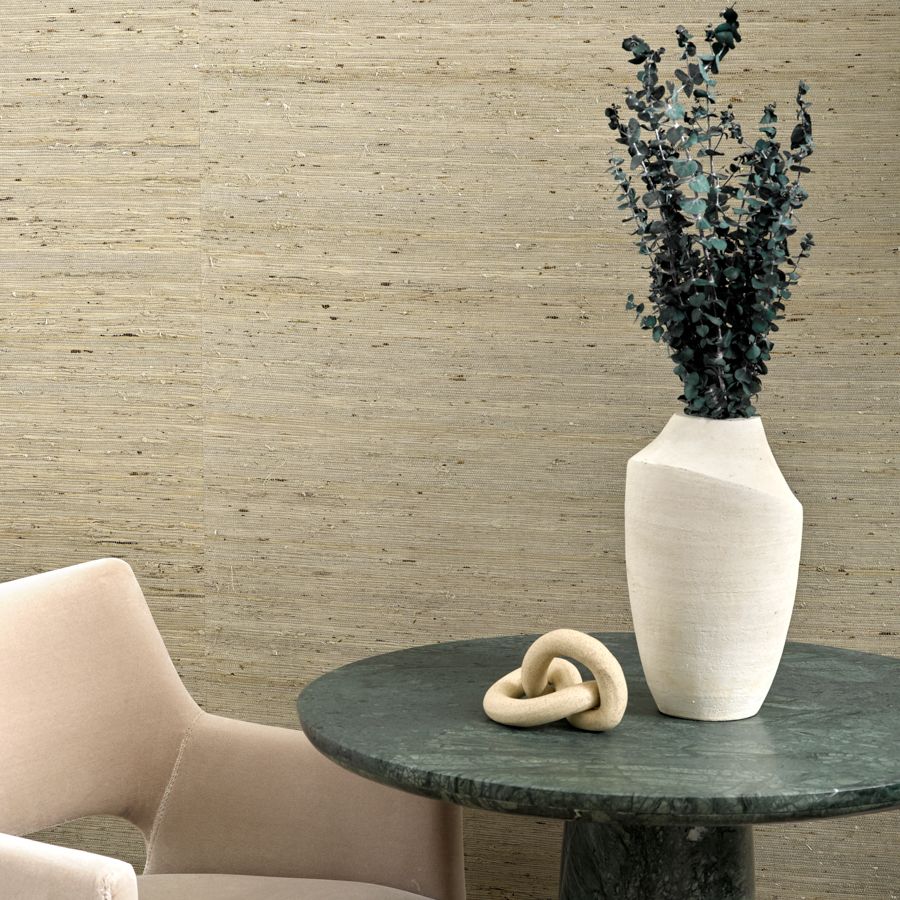 Harbor embraces the natural beauty of arrowroot fibers in a soothing, woven texture with a raw, tactile appeal. Characterized by organic variation and movement, the wallcovering is crafted by dyeing and weaving naturally short arrowroot fibers, which are knotted together and then applied to a solid backing. Perfect for creating intimate, texture-rich spaces, Harbor is available in predominately soft tones that celebrate its natural surface.